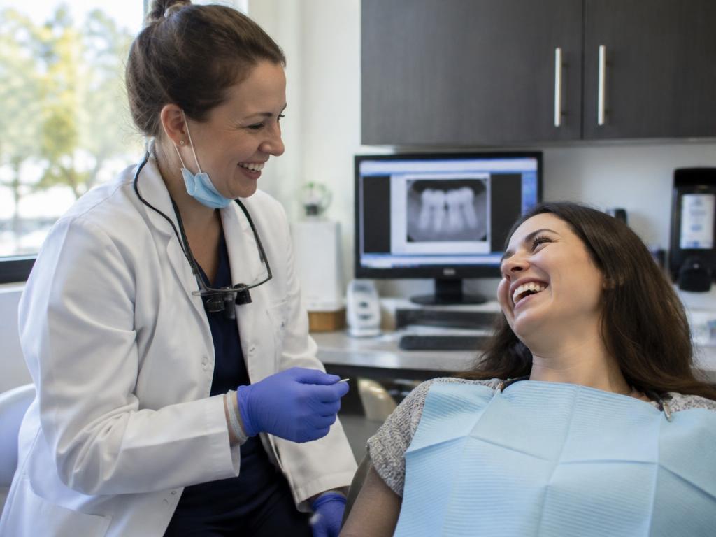 Smiling patient at a bright, welcoming dental office
