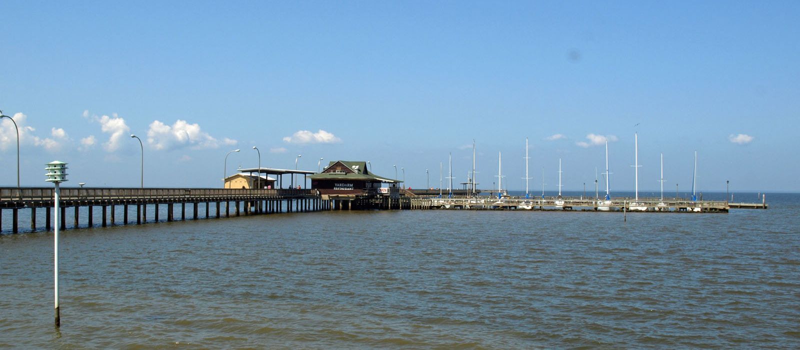 The Fairhope Municipal Pier reaching out into Mobile Bay at Fairhope, Alabama
